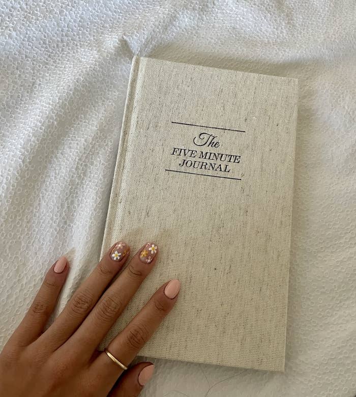 May holding the Five Minute Journal