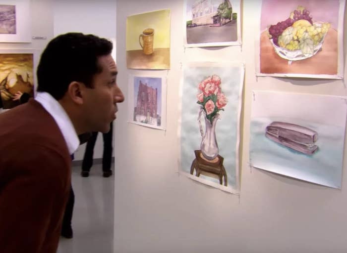 A man looking at art in a gallery