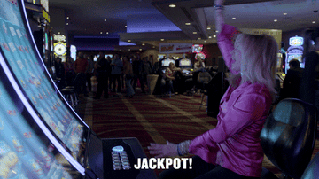 A woman in a casino saying, &quot;Jackpot!&quot;