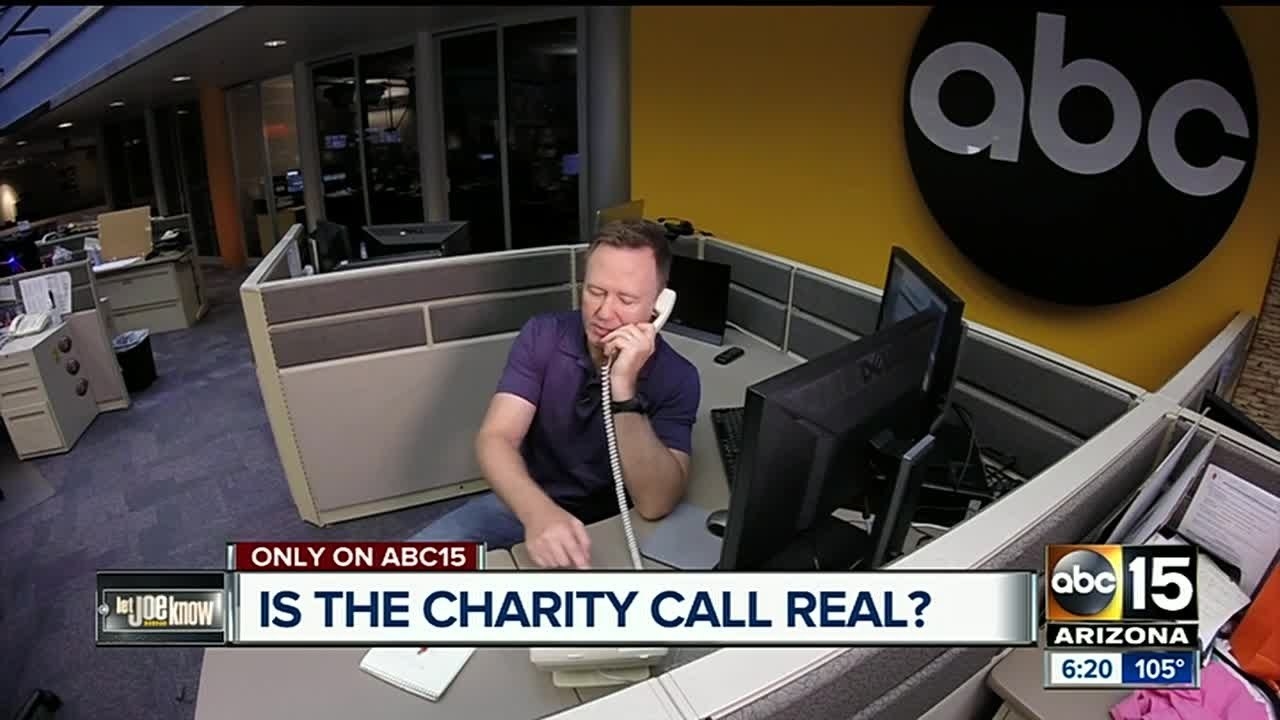 A newsperson on the phone with the words, &quot;Is the charity call real?&quot;