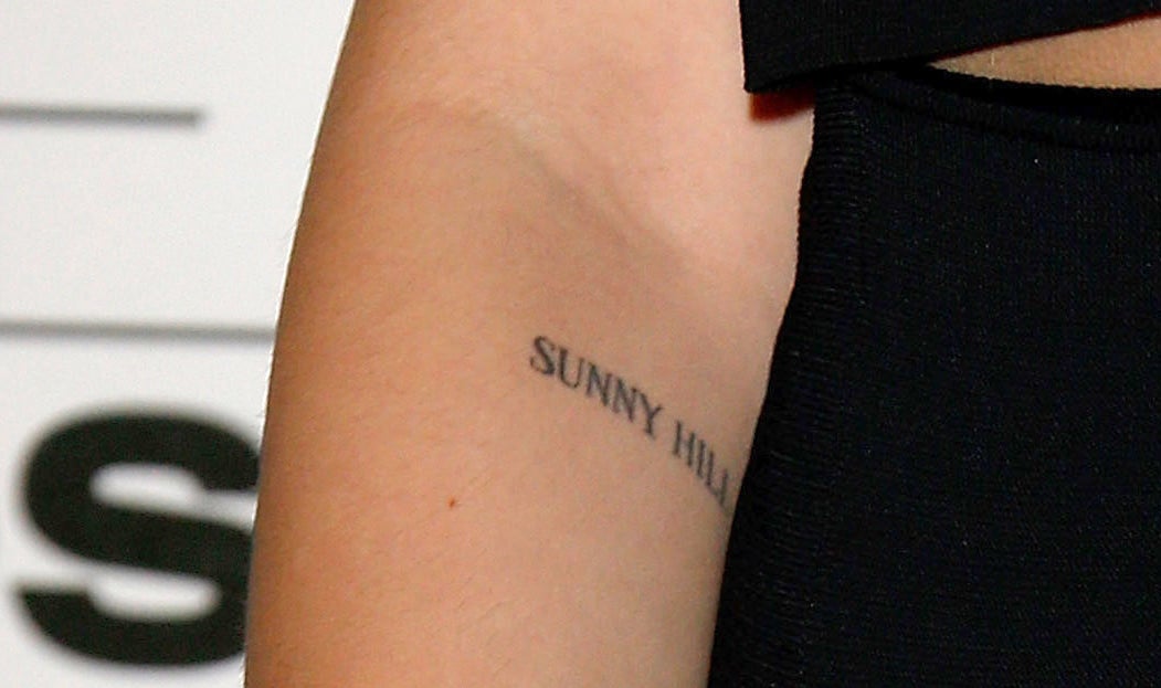 A closeup of the tattoo, which is printed in simple font just below Dua&#x27;s elbow