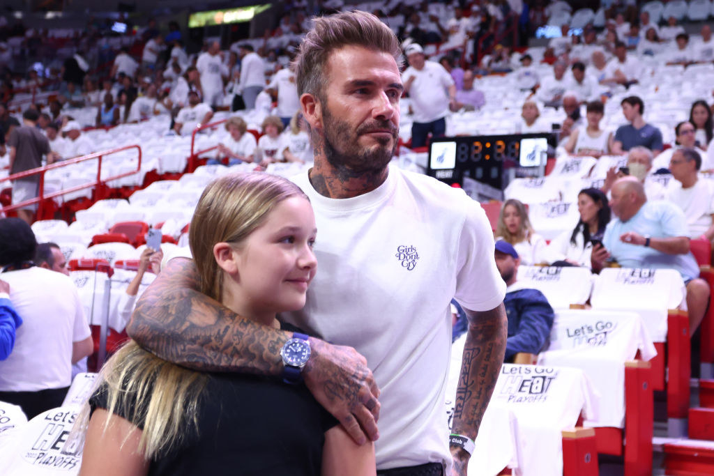 David hugging his daughter at a sporting event