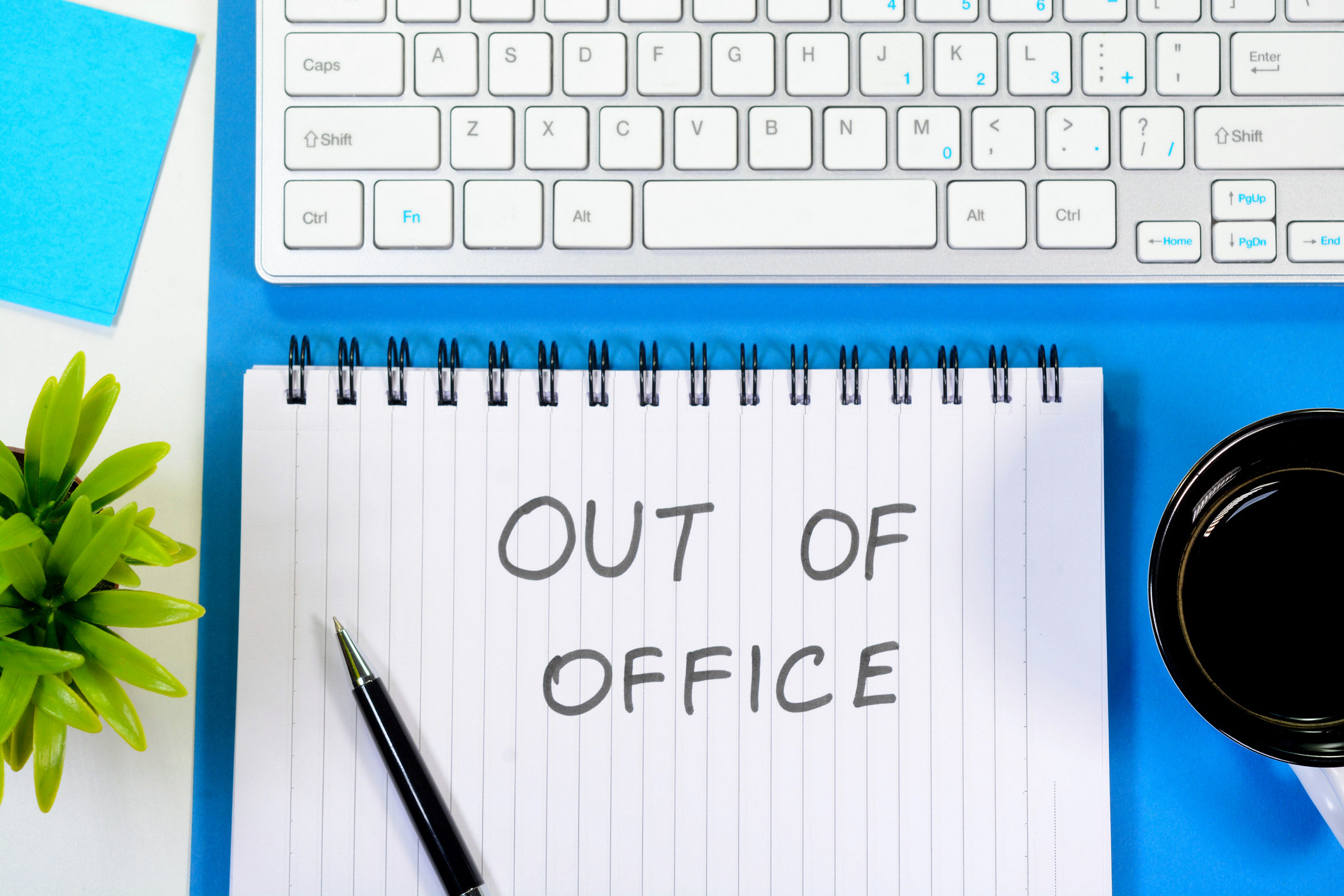 a notepad that says out of office