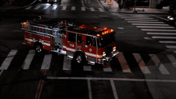 two fire trucks with their sirens on