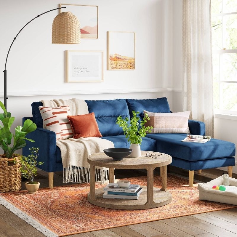 the blue sofa in a decorated living room