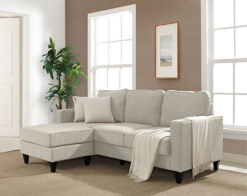 the beige sofa in a decorated living space