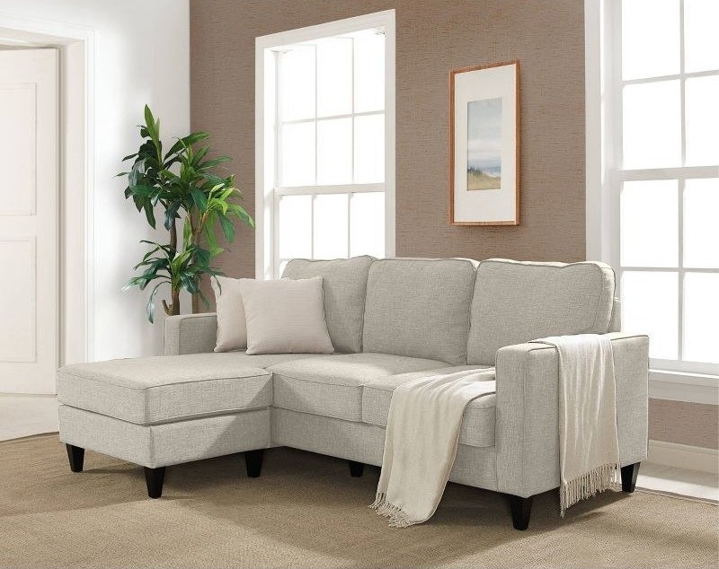the beige sofa in a decorated living space