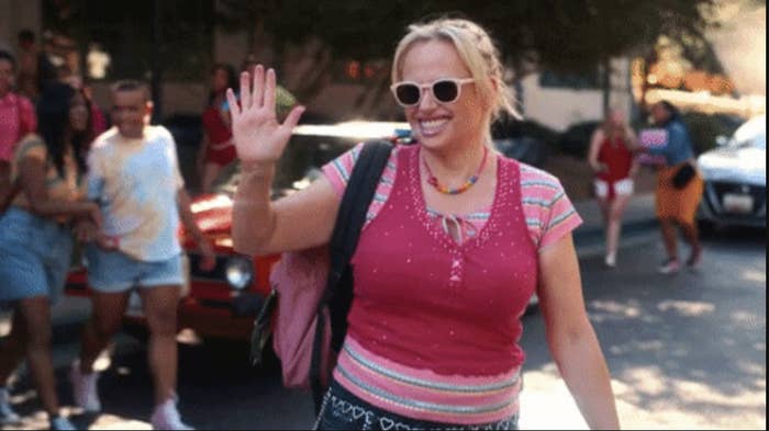 Rebel smiles and waves in a scene from the film