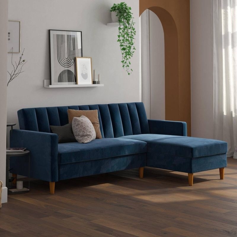 the blue velvet couch in a living room