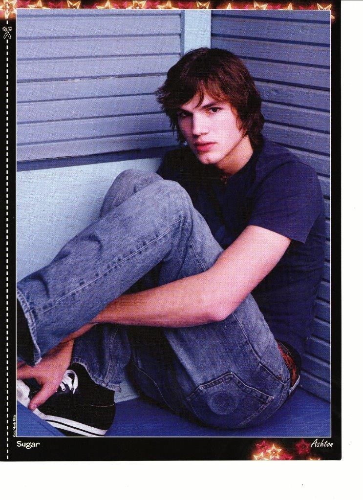 Ashton Kutcher sitting in a corner