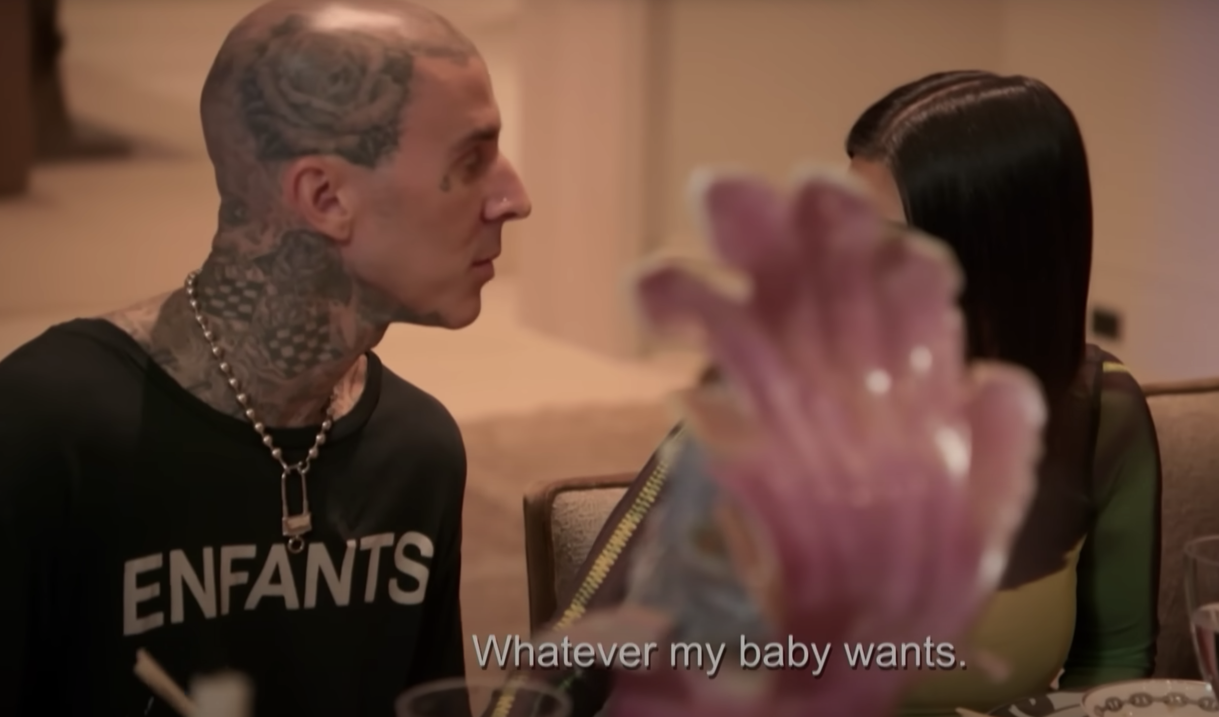 Travis talking to Kourt at the dinner