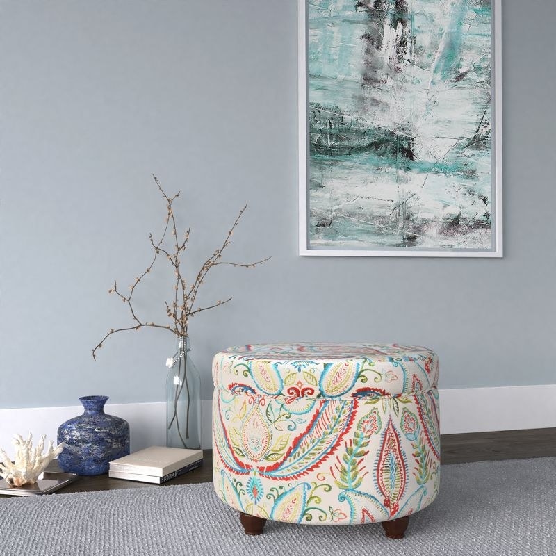 The ottoman in bold paisley in use