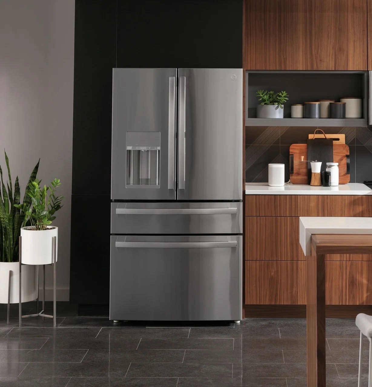 a silver smart fridge in a kitchen