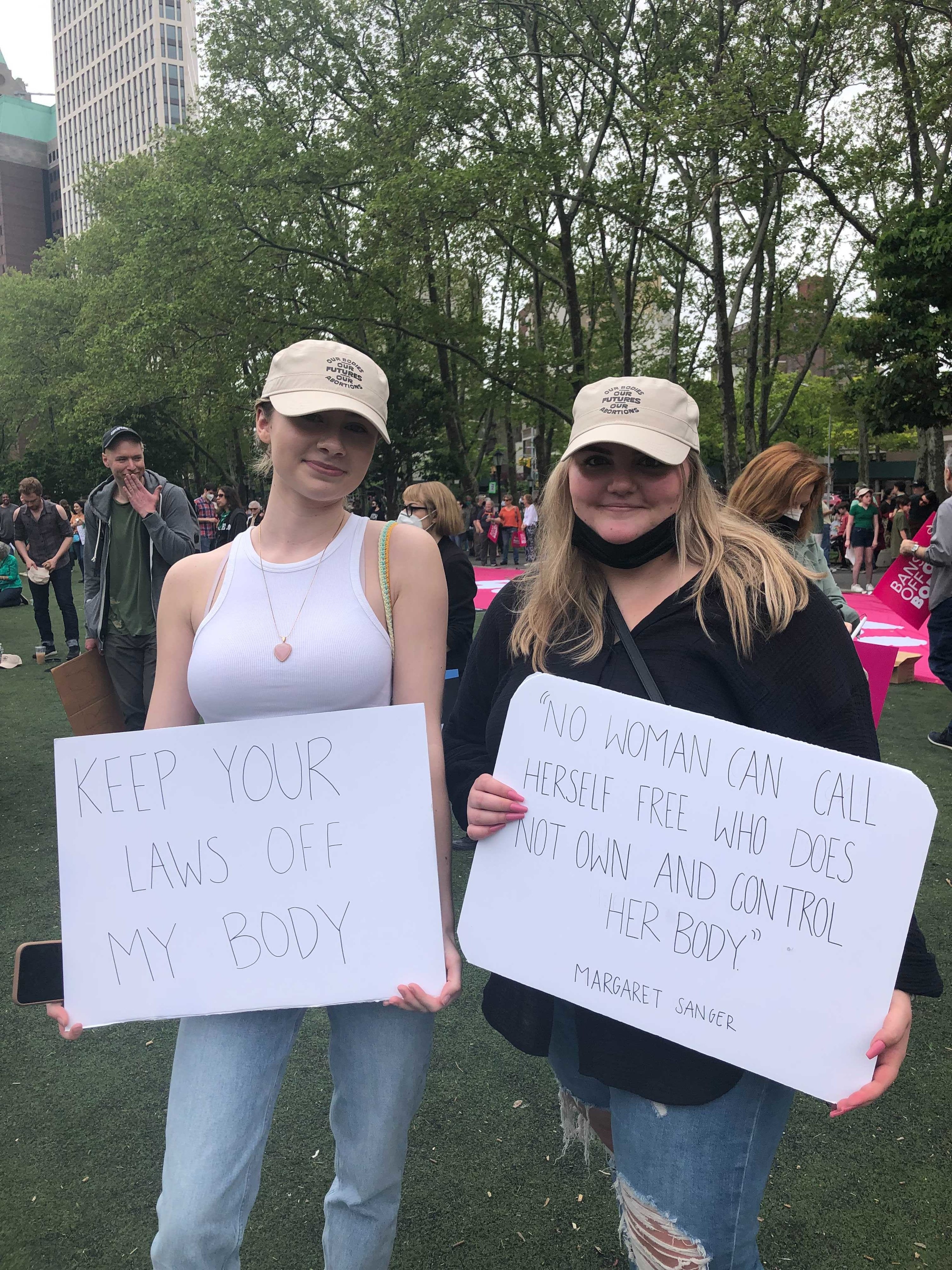 Signs reading &quot;Keep your laws off my body&quot; and &quot;&#x27;No woman can call herself free who does not own and control her body&#x27; — Margaret Sanger&quot;