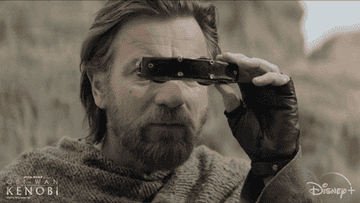 Obi-Wan Kenobi (Ewan McGregor) looking through binoculars