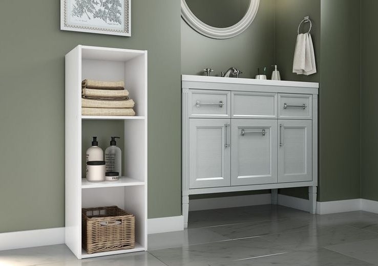 The shelf in white being used in a bathroom