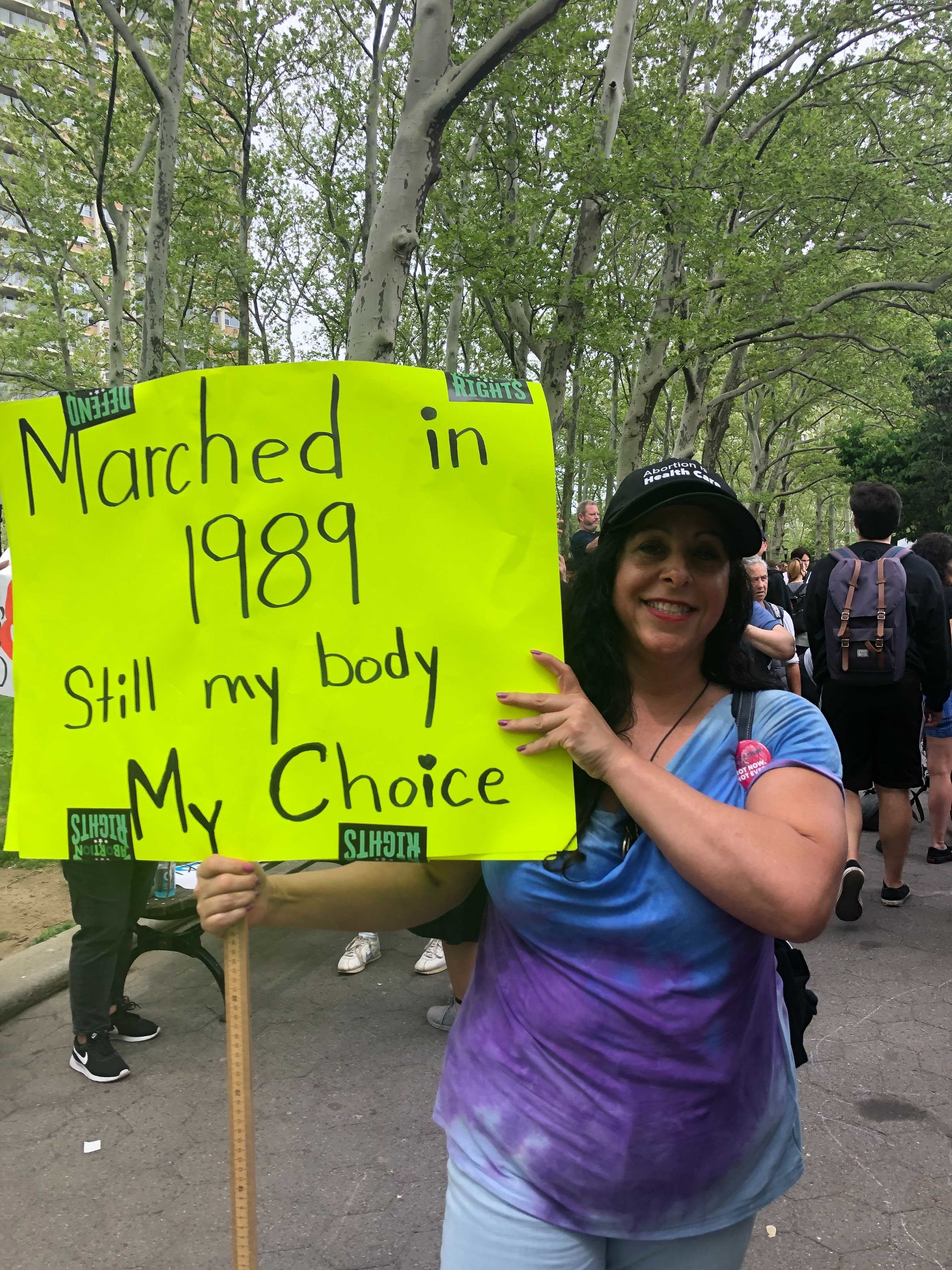 A protestor with her sign, &quot;Marched in 1989, still my body my choice&quot;