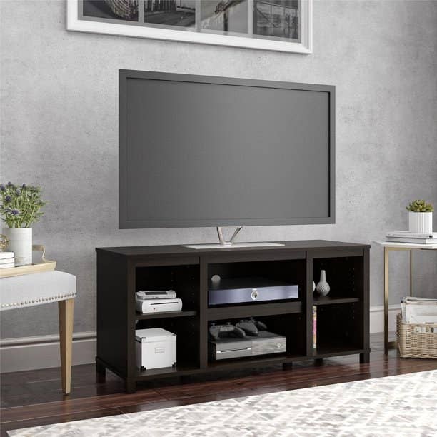 A TV stand with six compartments