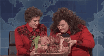 Kate McKinnon and Aidy Bryant with a basket of red meat on SNL