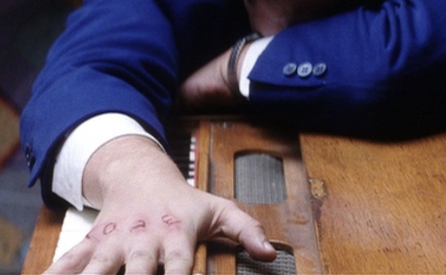 Adam Sandler with cuts on his knuckles in Punch Drunk Love
