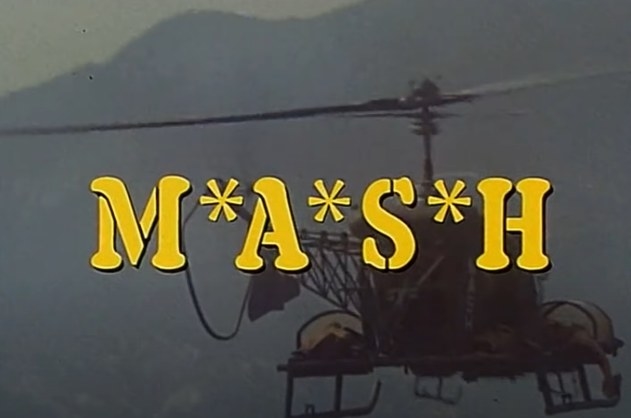 A helicopter with the word &quot;MASH&quot; over it
