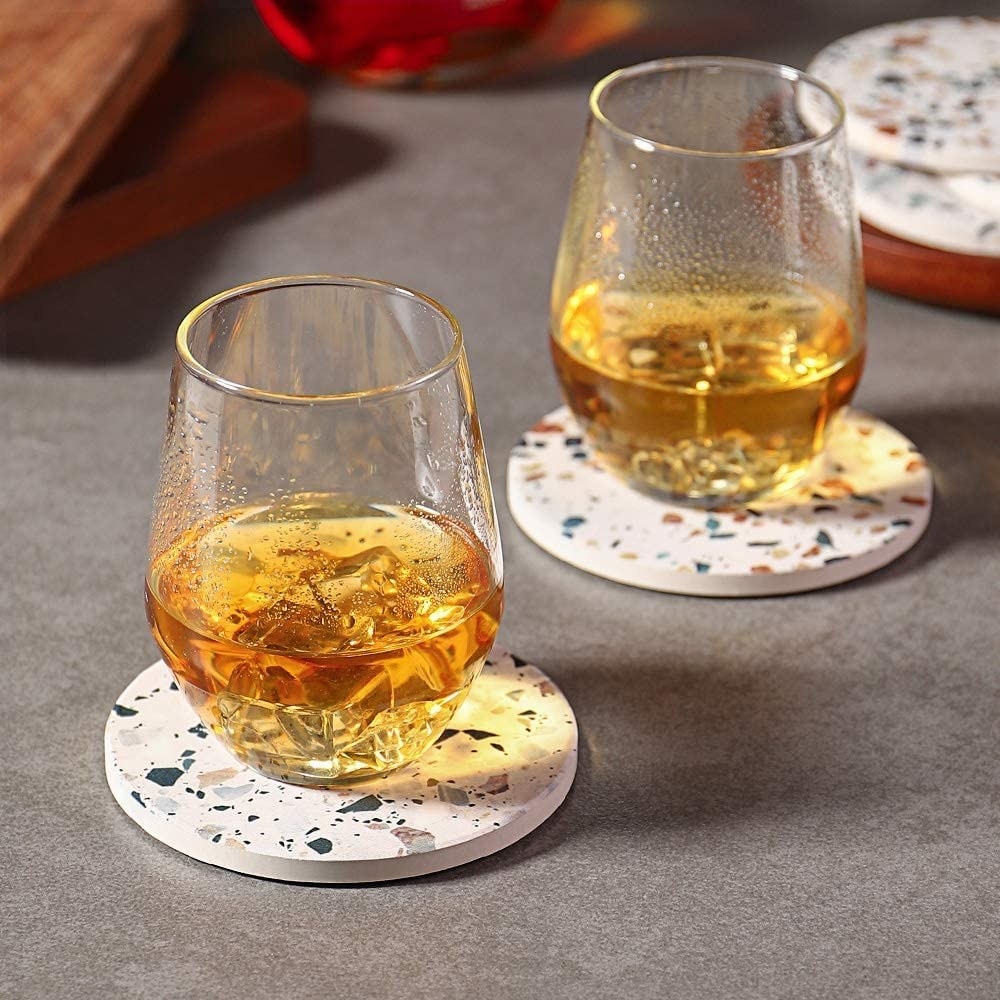 Two glasses on coasters