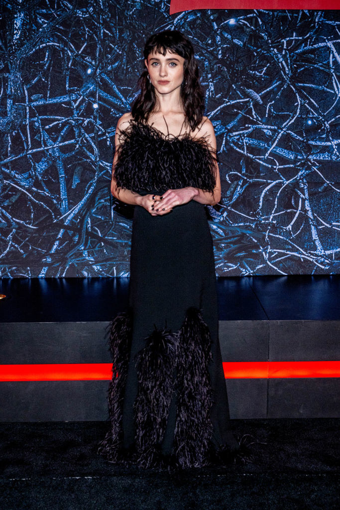 Natalia wearing black gown with large frilly sections on the upper body and at the very bottom