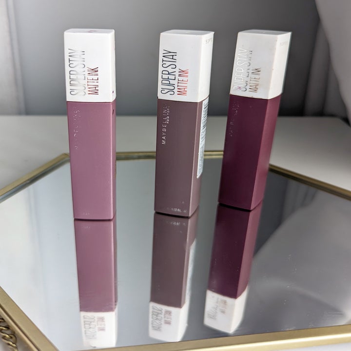 Three tubes of lipstick in a row