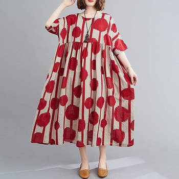 red polka dot and striped sleeved dress that hits just above the ankle
