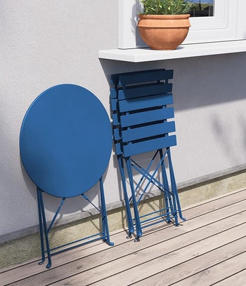 the blue bistro set folded up flat