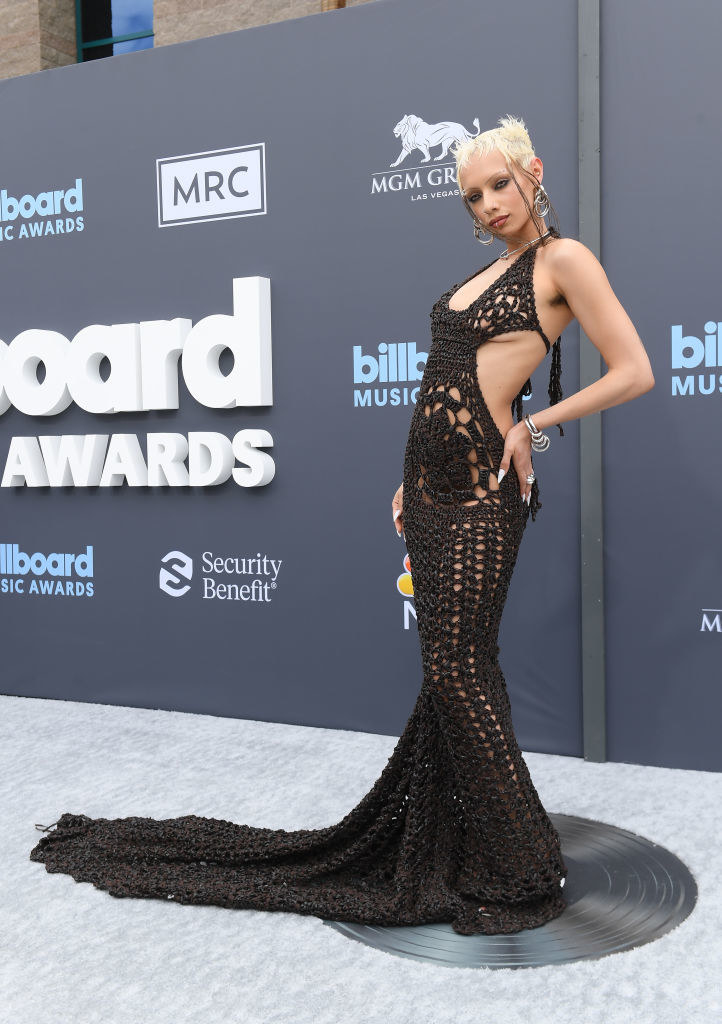 Jazelle wearing a completely crochet dark brown knitted gown on the BBMAs red carpet.