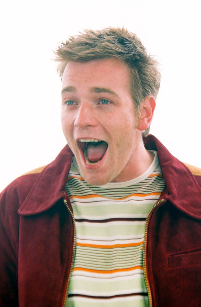 Ewan in a striped shirt and jacket with his mouth wide open