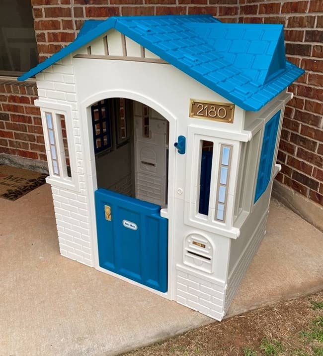reviewer photo of the white and blue playhouse