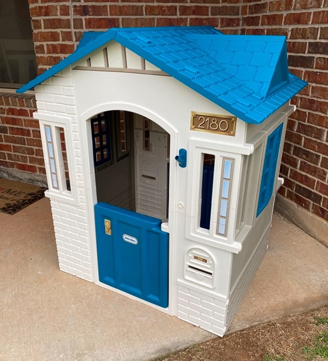 reviewer photo of the white and blue playhouse