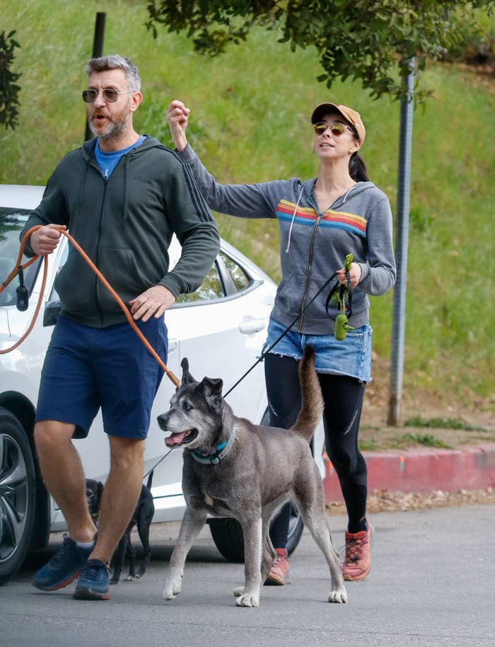 Sarah and Rory walking two dogs together