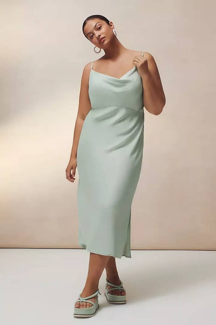 A model wearing the slip dress in the color Mint