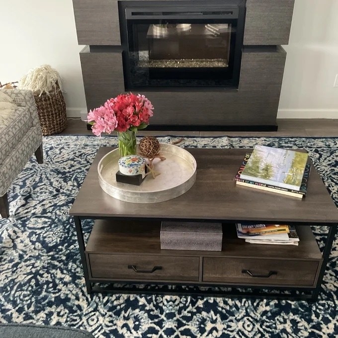 reviewer image of the coffee table with metal frame and two lower drawers