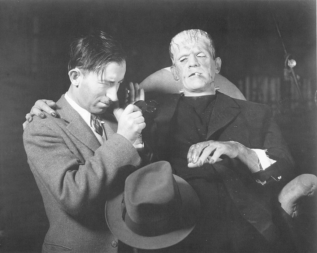 Boris Karloff on the set of Frankenstein with a member of the film crew