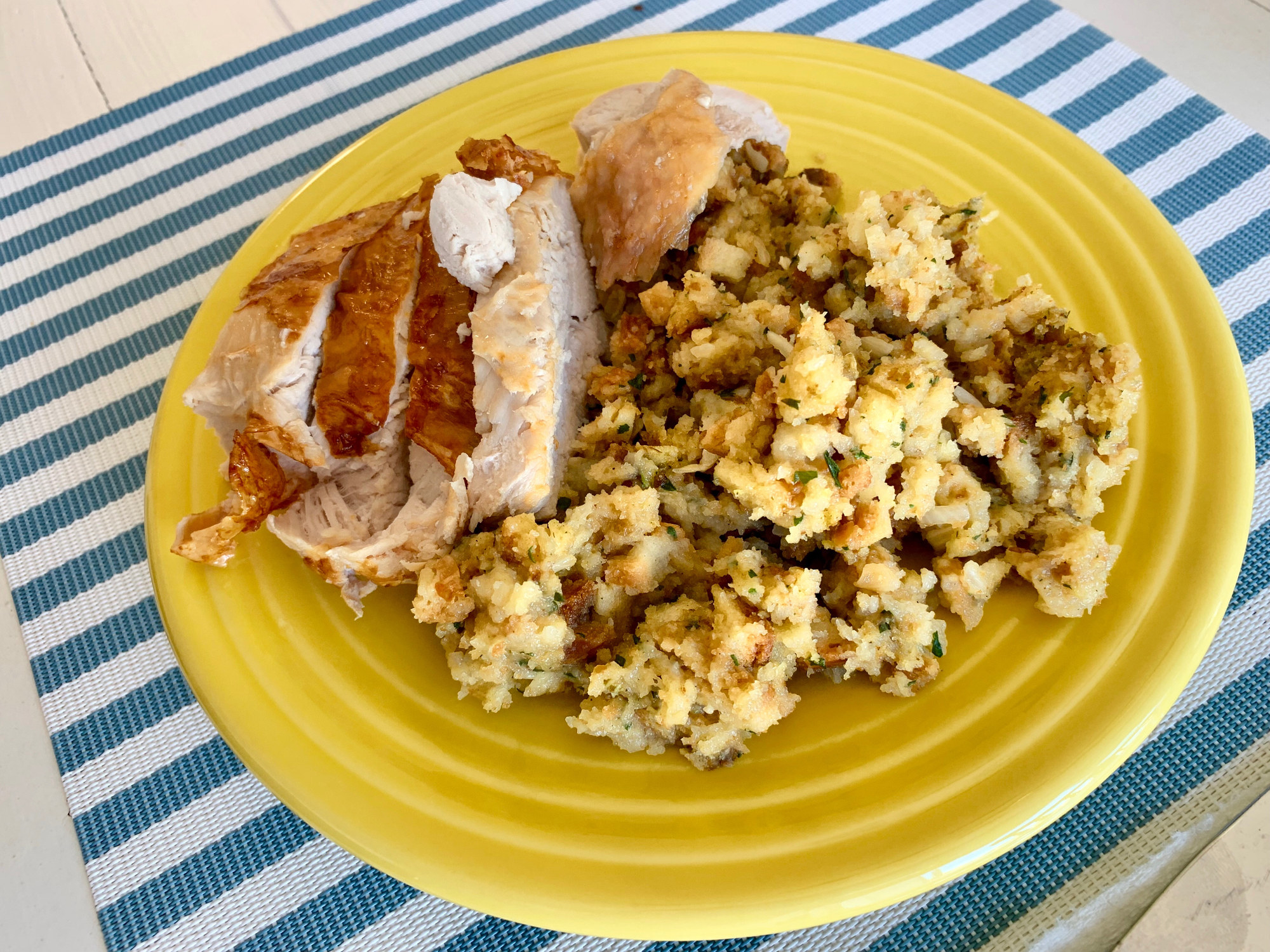 A plate of turkey breast and stuffing