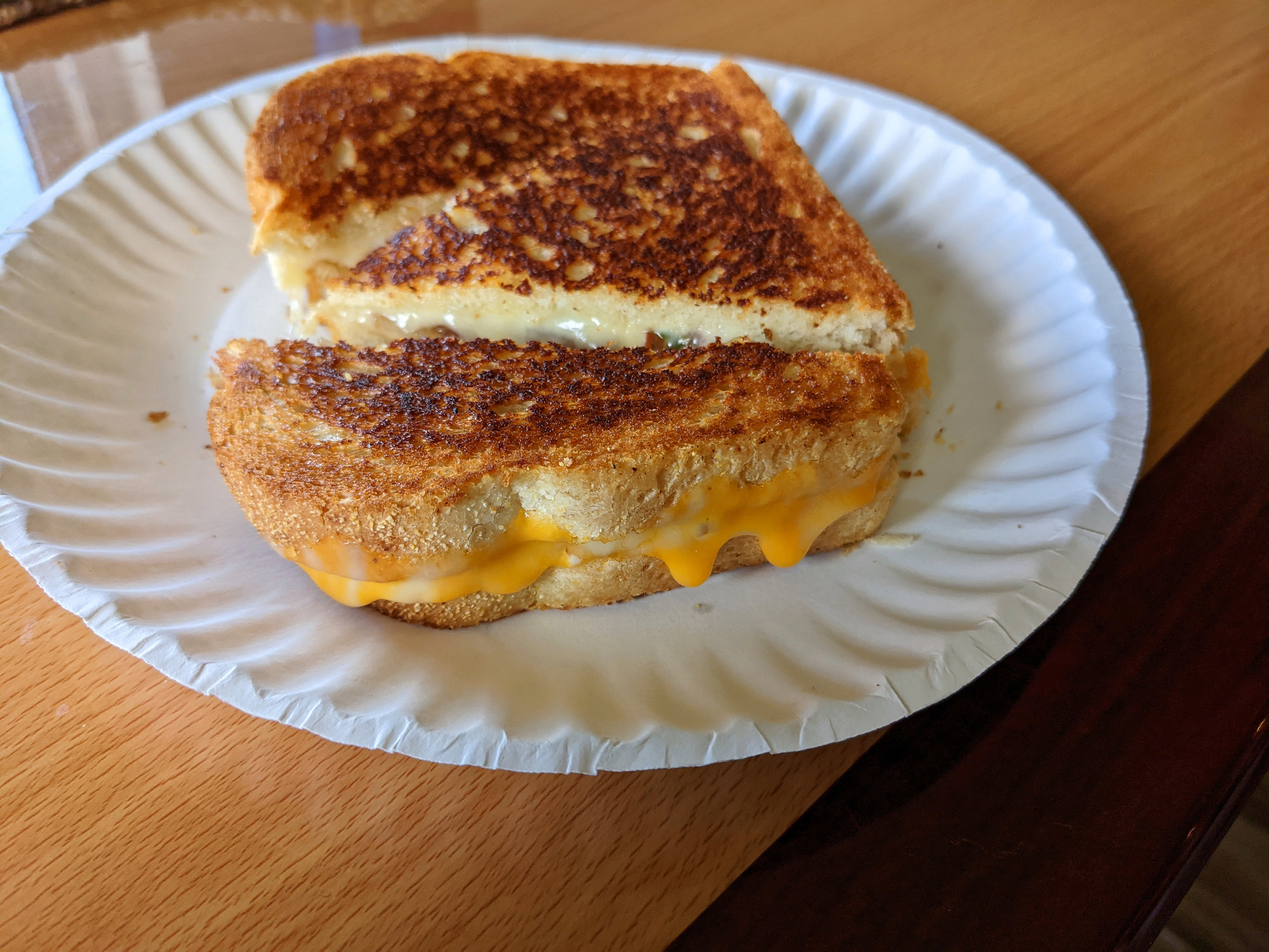Perfectly grilled cheese sandwich with cheese oozing out the sides
