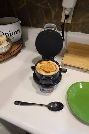 the sandwich maker preparing a sandwich
