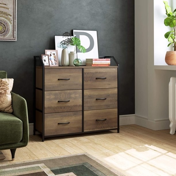 A six drawer dresser in rustic brown