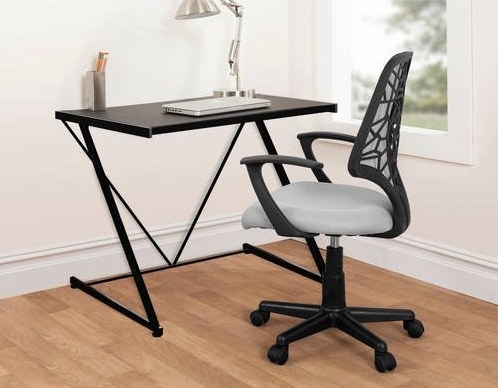 A black z-shaped metal desk