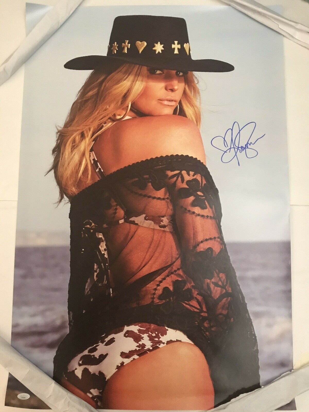 An autographed photo of Jessica Simpson at the beach