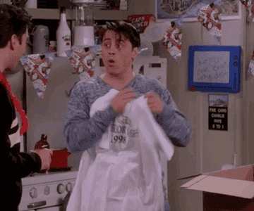Matt LeBlanc as Joey holds up a t-shirt of himself in &quot;Friends&quot;