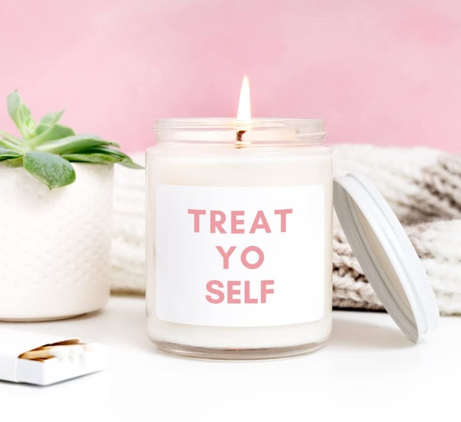 A candle with a label that says treat yo self