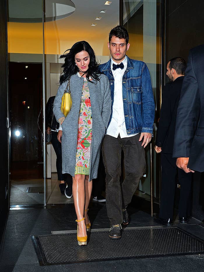 Katy and John walking out of a building