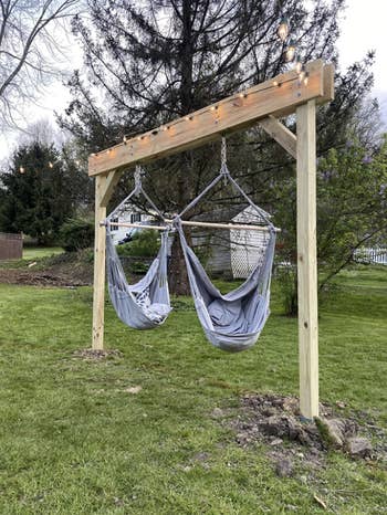 two blue hammocks in reviewer's backyard