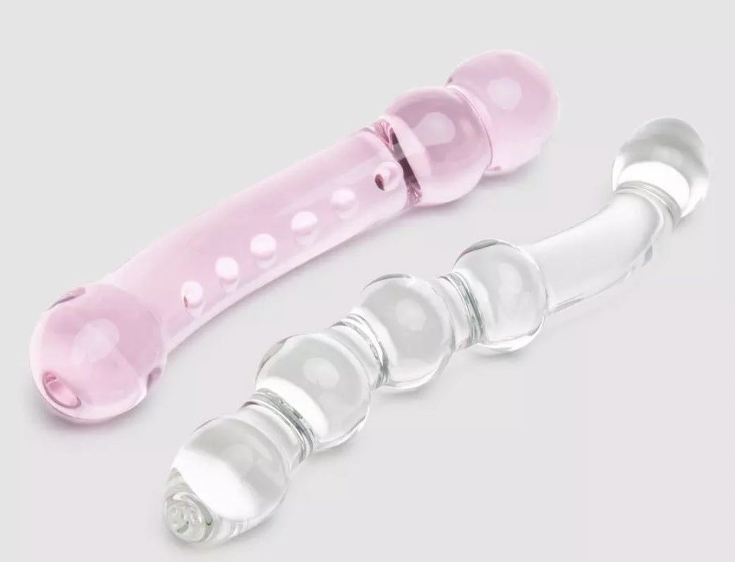 The pink curved dildo with small texture bumps and clear glass dildo with raised nodules on shaft