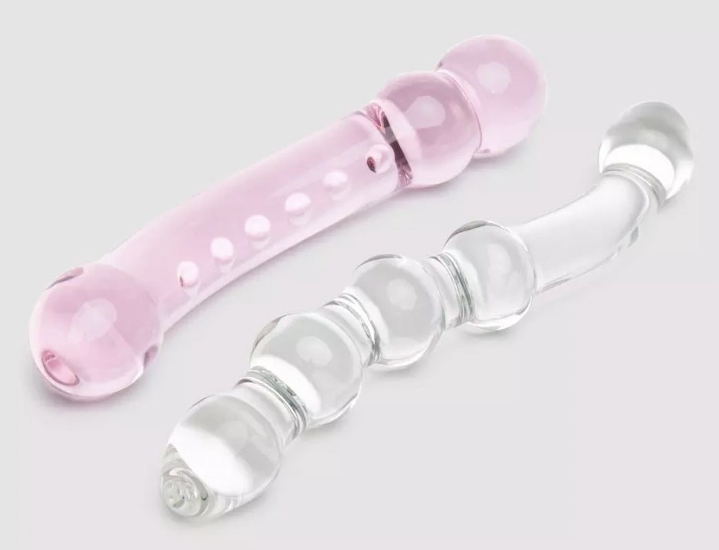 The pink curved dildo with small texture bumps and clear glass dildo with raised nodules on shaft